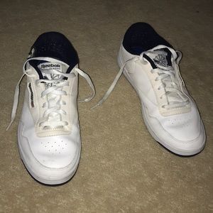 White Reebok Classic athletic shoes.